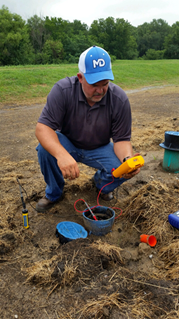 Jerry Regula, McWane Ductile Product Engineer measures pipe corrosion.