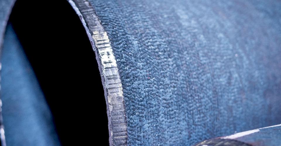 Beveled Ductile iron pipe close-up.