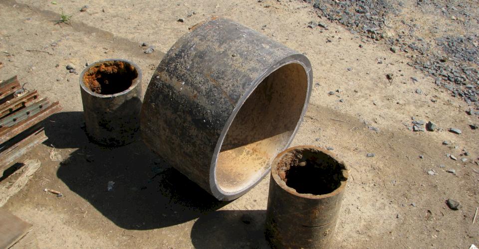 Cement mortar lining solves the problem of Tuberculation as shown with the pipe in the center.