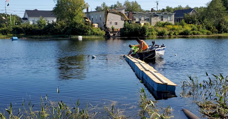 Clipping and collecting flotation planks.