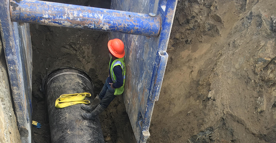Ductile iron pipe in a trench.