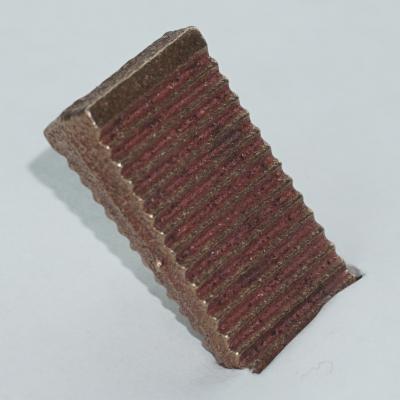 A Serrated Bronze Wedge.
