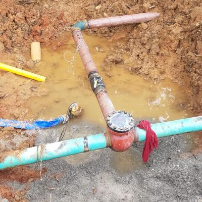 Magnesium bag anode ( middle left ) connected to gas main under construction in vicinity of DI waterline ( top right ).