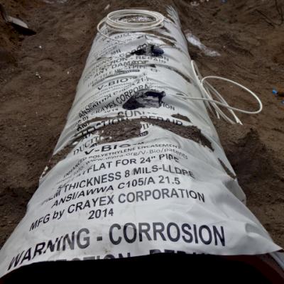 Close-up V-Bio polyethylene encasement used in CP system on DI pipe.