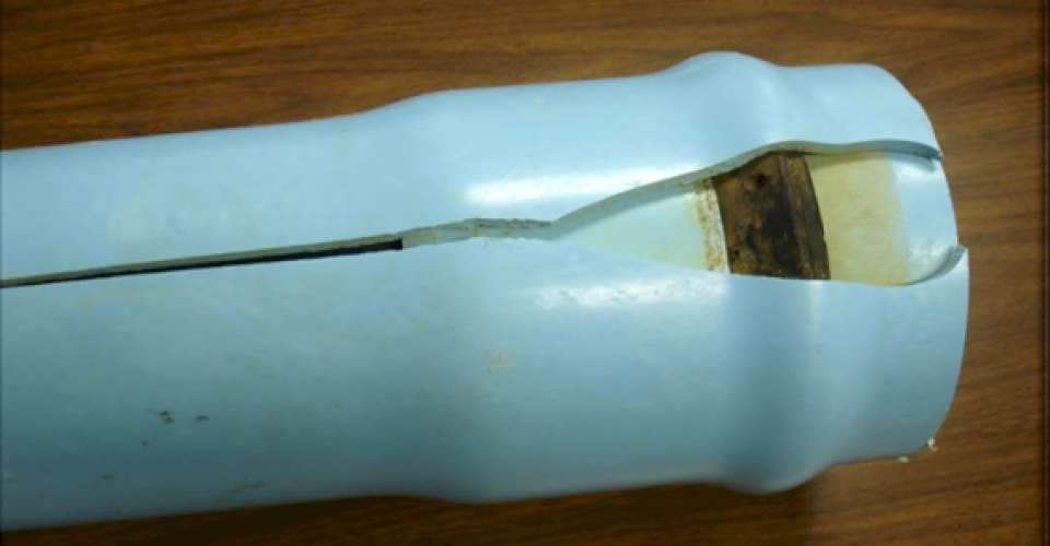 Cracked and split PVC pipe due to over-belling.
