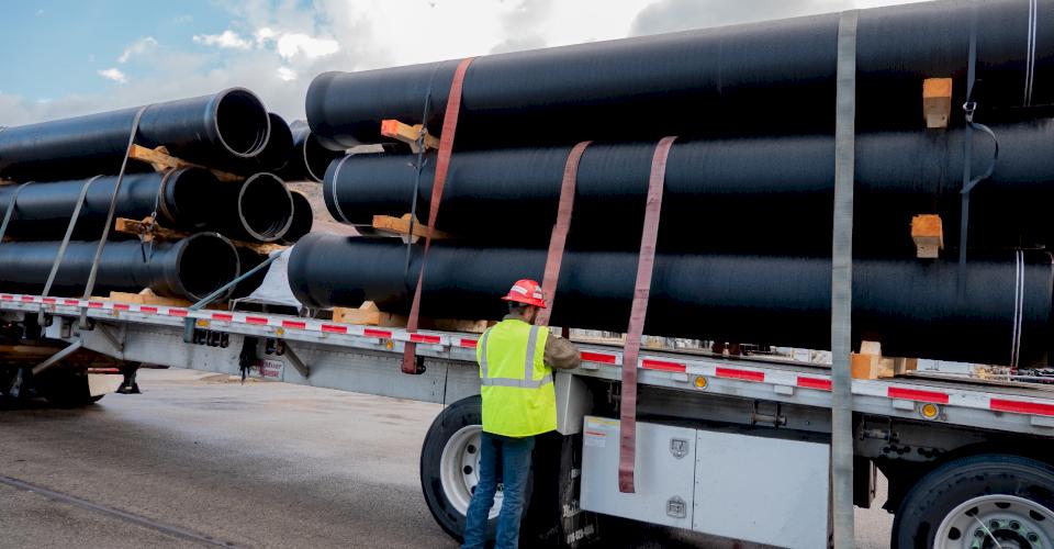 A truck with Ductile iron pipe.