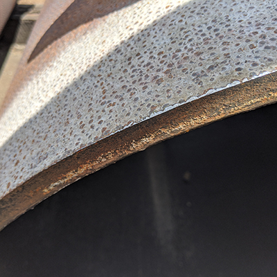 A chamfered edge on a pipe close up.