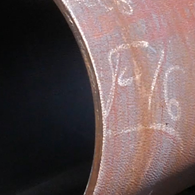 A field-cut pipe, close-up.