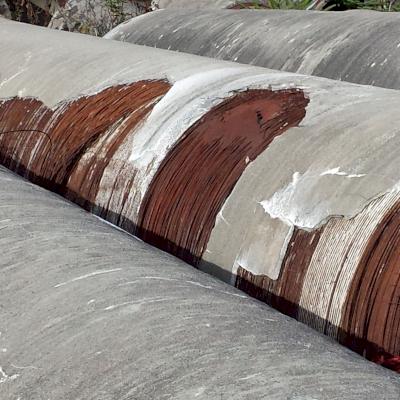 Failing Prestressed Concrete Cylinder Pipe.