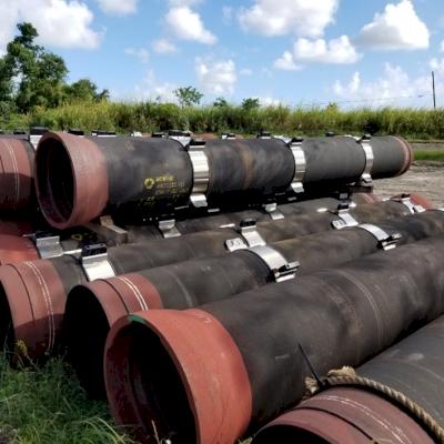 Casing spacers already installed on DI pipe that has not yet been pulled through a casing pipe.