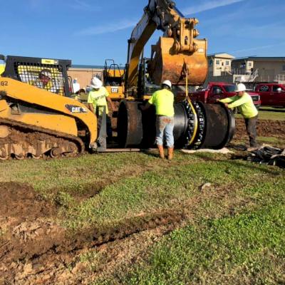 Lifting the pipe in place.