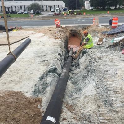 An HDD install using the cartridge method of pulling and installing one piece of DI pipe at a time.