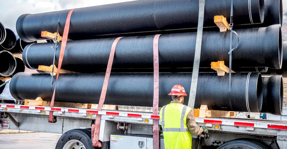 A truckload of DI pipe is prepped for transport.