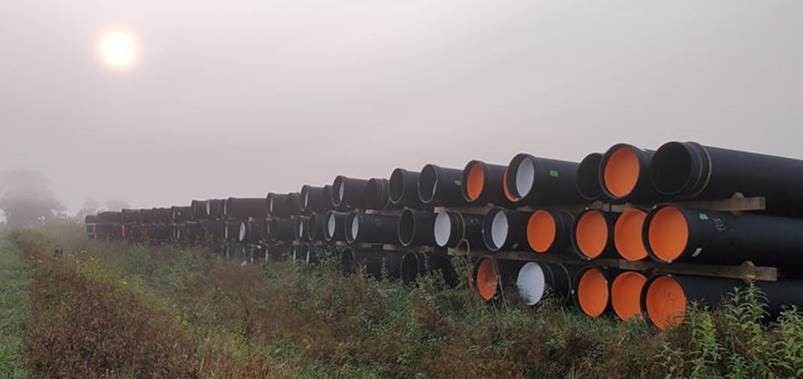 Ductile iron pipe awaits installation.