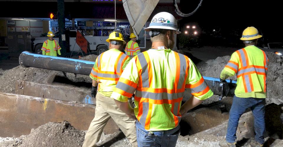 Night time pipe installation takes place in Miramar, Florida.