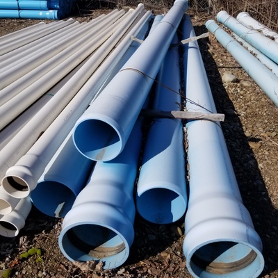 The blue PVC pipe is nearly white from the effects of ultraviolet rays.