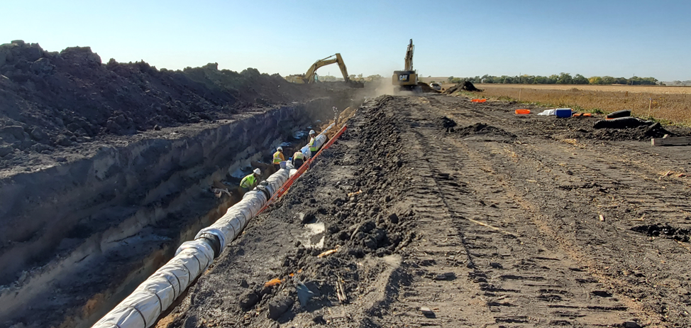 Ditch digging for pipe installation.