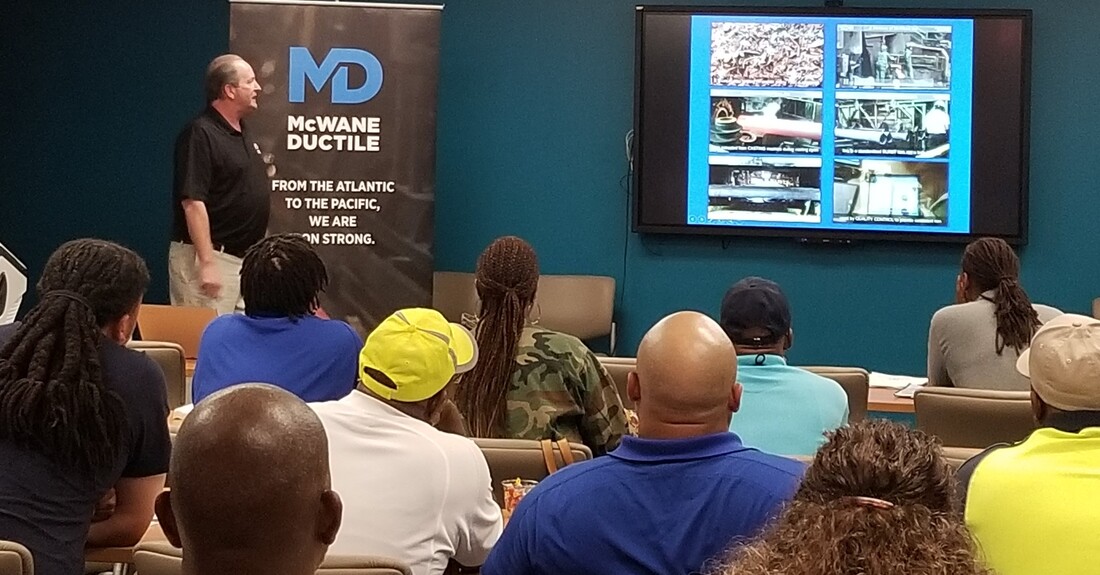 Ken Rickvalsky, McWane Ductile National Product Engineer, discusses projects with engineers and others during a Lunch & Learn.