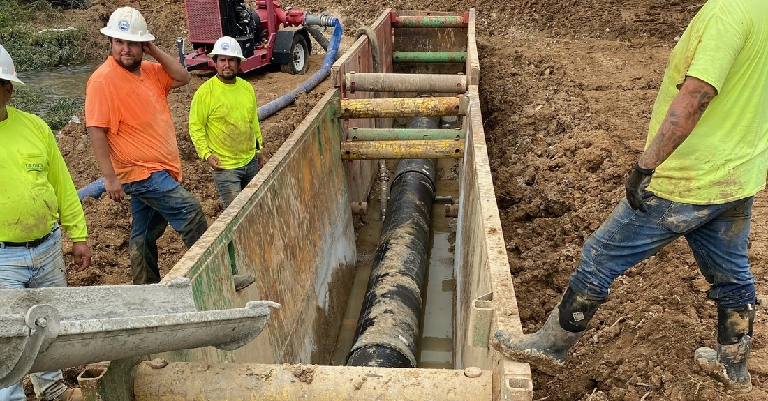 24" pipe in a trench - ready to be encased in concrete.