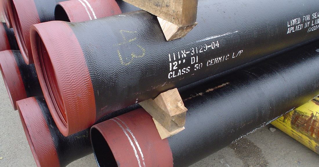 Amine cured novolac epoxy with ceramic quartz pigment. The crimson-colored bell and spigot (joint) protection is a thinner tinted application of the same ceramic epoxy.